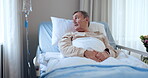 Cancer, wellness and a senior man in hospital for rehabilitation, treatment or recovery while lying in bed. Healthcare, thinking and iv drip with an elderly patient in a clinic for medical care