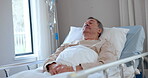 Cancer, healthcare and a senior man in hospital for rehabilitation, treatment or recovery while lying in bed. Health, wellness and iv drip with an elderly patient in a clinic for medical care