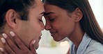 Love, intimate and young couple at their home relaxing, bonding and resting together on a weekend. Happy, smile and interracial man and woman with romance, connection and trust in their apartment.