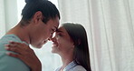 Couple, forehead touch and love in home lens flare, bonding and romance in the morning. Smile, interracial and happy man and woman intimate together for care, healthy relationship and commitment.