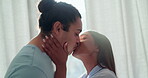 Couple, kiss and love in home lens flare, bonding and romance together in the morning. Smile, interracial and intimate man and woman smooch for care, healthy relationship and commitment to marriage