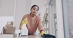 Cleaning, spray and chemical with woman in living room for hygiene, housekeeping and bacteria. Furniture, sanitary and disinfection with person in apartment home for cleaner, maid and detergent