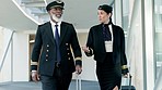 Airport, talking and pilot walking with an air hostess for communication while boarding a flight. Discussion, hospitality and African man airplane captain speaking to woman flight attendant in hotel.