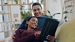 Couple, tablet and relax on a home sofa for search, internet and social media. Happy man and woman laugh together on couch with technology for funny video, online communication and website or app