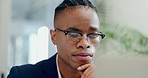 Business man, computer and thinking of plan in office or reading email or problem solving. Face of serious african entrepreneur person with technology for feedback, decision and solution or choice