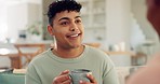 Conversation, coffee and couple on a sofa in the living room relaxing, talking and bonding together. Happy, smile and young man speaking to his girlfriend and drinking a latte in the lounge at home.