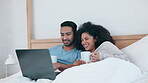 Laptop, coffee and laughing with a couple in bed together in the morning to relax in their home. Computer, social media or app with a man and woman watching a movie in the bedroom of their apartment