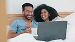 Laptop, video and funny with a couple in bed together in the morning to relax in their home. Computer, social media or laughing with a man and woman watching a movie in the bedroom of their apartment