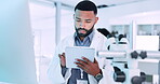 Tablet, science and research with a man doctor in a laboratory for innovation or medical breakthrough. Technology, healthcare and future with a young scientist working in a pharmaceutical lab