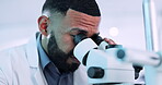 Scientist, man and microscope in laboratory for  research, DNA analysis and pharmaceutical development or medical study. Professional science person with biotechnology and lens check for particles