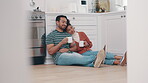 Drink, coffee and couple relax in kitchen on floor together in conversation, communication or bonding with beverage. Drinking, tea or people talking with hot chocolate in home on weekend or holiday