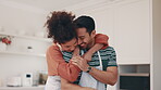 Cooking, food and a couple hugging in the kitchen of their home together for a romantic meal on their anniversary. Smile, love or nutrition with a happy man and woman preparing vegetables in a house