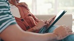 Happy couple on sofa with tablet, scroll social media meme or funny internet video in home together. Relax, man and woman on couch browsing, checking online post or joke on website with digital app.