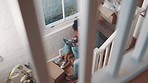 Real estate, tablet and couple on the stairs of new house for planning renovation, research or moving idea from above. Property, success and homeowner people online for relocation service app review