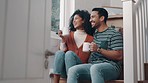 Happy couple, coffee and laughing in morning relax, funny joke or humor together and bonding on stairs at home. Man and woman drinking tea or beverage in happiness or satisfaction for holiday break