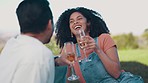 Love, picnic and cheers with couple and champagne in nature for summer vacation, relax and happiness. Smile, peace and celebration with man and woman in park for wellness, romance or anniversary date