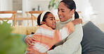Hug, love and mother with daughter on sofa for playful, bonding and relax. Smile, happiness and care with woman and young girl in living room of family home for embrace, fun and games together
