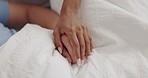 Love, touch and hands of couple in bed for intimacy, care and affection at home in morning. Healthy relationship, marriage and people in bedroom laying together for bonding, commitment and embrace