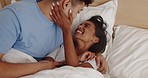 Laugh, tickling and couple in bed in morning for cuddle, bonding and healthy relationship together. Playful, dating and happy man and woman in bedroom for relaxing, playing game and support at home