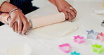 Cookies, baking and hands of mother and daughter in kitchen for cooking, help or learning. Food, love and support with closeup of people and rolling pin in family home for dessert, recipe or pastry