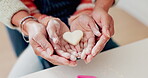 Baking, heart and hands of mother and daughter in kitchen for cooking, helping or learning. Food, love and support with closeup of people and cookies in family home for dessert, recipe or pastry