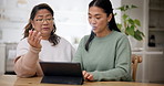 Tablet, technology and woman teaching senior frustrated by internet on retirement and learning communication device. Social media, discussion and elderly person and daughter use app in living room