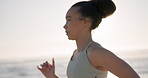 Running, beach and woman with fitness, exercise and workout with wellness, lens flare and active. Person, athlete and runner with training, seaside and breathing with health, fresh air and cardio