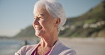 Senior woman, smile and sunset on beach to relax with peace outdoor in nature, sea and elderly female person with mindfulness. Happy, face and old lady thinking by a ocean on holiday in retirement