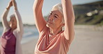 Yoga, meditation and senior women, stretching and fitness on beach for wellness, exercise and pilates training. Zen, friends and old people for muscle health, mindfulness and relax in nature and sea