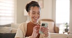 Young woman, phone and laugh on sofa, thinking and relax in home living room for texting, web chat or blog. Girl, excited smile and smartphone with click, meme or social network app on lounge couch