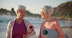 Exercise, yoga and senior woman on the beach together as friends for a mental health workout by the ocean. Fitness, wellness and smile with elderly people at the sea for pilates training in nature