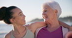 Fitness, beach and a senior woman with her personal trainer for an outdoor workout by the ocean. Exercise, funny and an elderly person with a coach at the ocean for training or physical activity