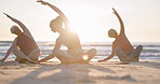 Beach yoga class, sunset and instructor coaching mindfulness pose, stretching and morning workout. Sun flare, nature sunshine and spiritual people learning pilates, training and coach teaching group