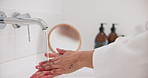 Water, skincare and a person washing hands in the bathroom of a home closeup for fresh hygiene. Health, wellness and beauty with a woman cleaning by the basin to remove bacteria from her skin