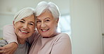 Senior friends, hug and smile for portrait in home together with support, love and happy profile picture in retirement. Laughing, face and elderly women care for old friendship and embrace in house