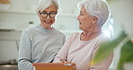 Tablet, social media and senior woman friends browsing the internet while in their home for retirement. Technology, smile and surprise with elderly people using an app for good news or information