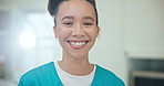 Face, smile and a woman nurse in an assisted living home for healthcare, help or senior care. Portrait, medical and support with a happy young caregiver in the living room of a house closeup