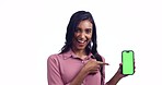 Happy woman, wow or green screen on a phone for presentation space, promotion announcement. Face, pointing or excited Indian person on white background in studio for mockup sale, deal or choice list