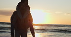 Couple, love and woman on piggyback, sunset and beach in los angeles on vacation and travel for relax, holiday and happiness. Sunrise, romance and people walking together in nature for trust 