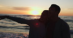 Beach sunset, silhouette and couple hug, point and gesture at outdoor view, date destination and relax on twilight travel vacation. Sea waves, marriage love and bonding people with nature fresh air  