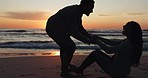 Beach, sunset and silhouette of playful couple on romantic vacation, holiday or adventure. Travel, love and shadow of young man having fun with woman by the ocean in evening on weekend trip together.