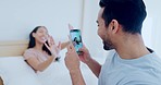 Couple, happy and photography on phone in bedroom, bonding in connection and having fun. Smartphone, picture and man and woman in bed, smile and funny laugh on social media to relax together in home