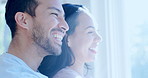 Face, window and a couple laughing in the bedroom of their home together while looking happy in the morning. Relax, smile or love with a man and woman waking up to a bright view in their apartment