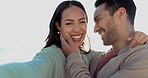 Selfie, face and couple at beach, kissing and bond together on vacation. Portrait, interracial man and funny woman in profile picture, happy memory and laugh on holiday to travel on sunset lens flare