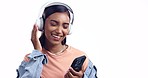 Woman, headphones and phone in studio, listening and dancing for choice, sound or happy by white background. Girl, smartphone and audio streaming subscription with web app, click and smile for music