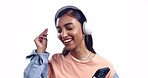 Woman, headphones and phone in studio, dancing and listening to music, sound and happy by white background. Girl dancer, smartphone and excited smile for audio streaming, subscription and web app