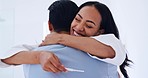 Happy, hug and couple with positive pregnancy test in the bathroom for celebration together. Smile, love and young excited man embracing his pregnant wife with a fertility stick device in modern home