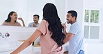 Brushing teeth, happy couple and bathroom with morning hygiene and toothbrush at home. Dental care, mirror and wellness with toothpaste and smile together in a house with mouth cleaning for routine