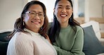 Happy, sofa and face of woman with her senior mother talking, bonding and laughing for funny joke. Smile, love and portrait of an Asian female person with her elderly mom in the living room at home.