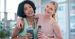 Friends, fitness and face of women hug at a sports studio after yoga, training or workout together. Exercise, portrait and happy woman embrace personal trainer at gym for pilates, wellness or health